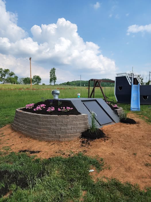Landscaped underground storm shelter entrance on a Kentucky property